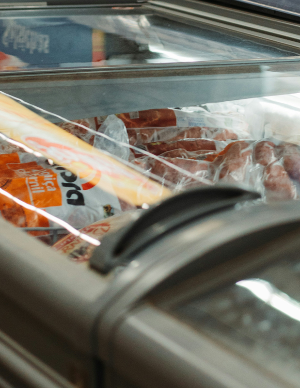 a reach in freezer containing various foods
